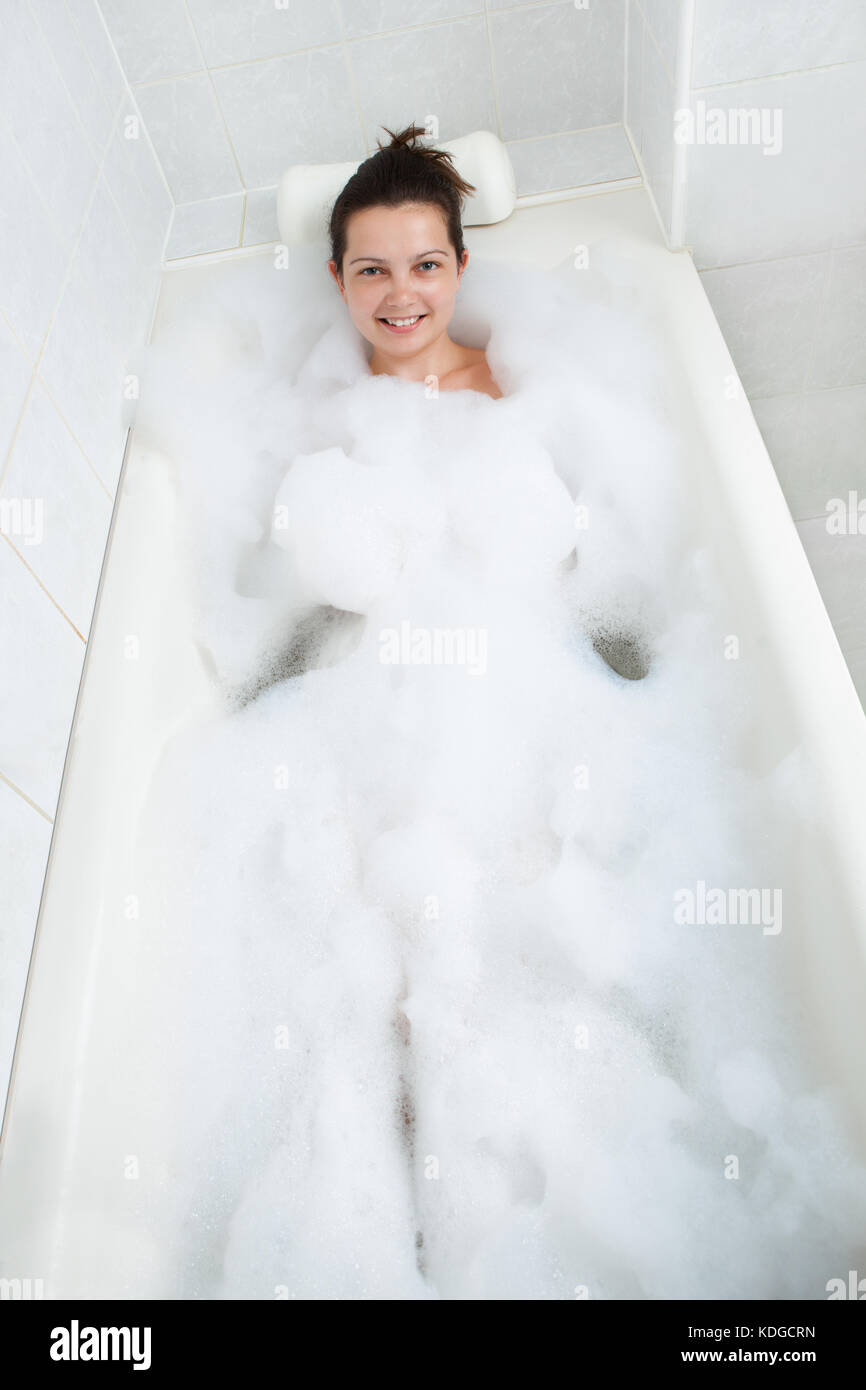 Portrait of a Happy woman bathing in bathtub Stock Photo Alamy