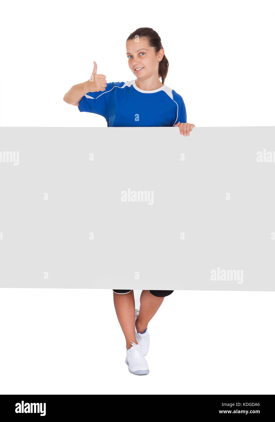 Happy young woman holding blank placard on white background Stock Photo