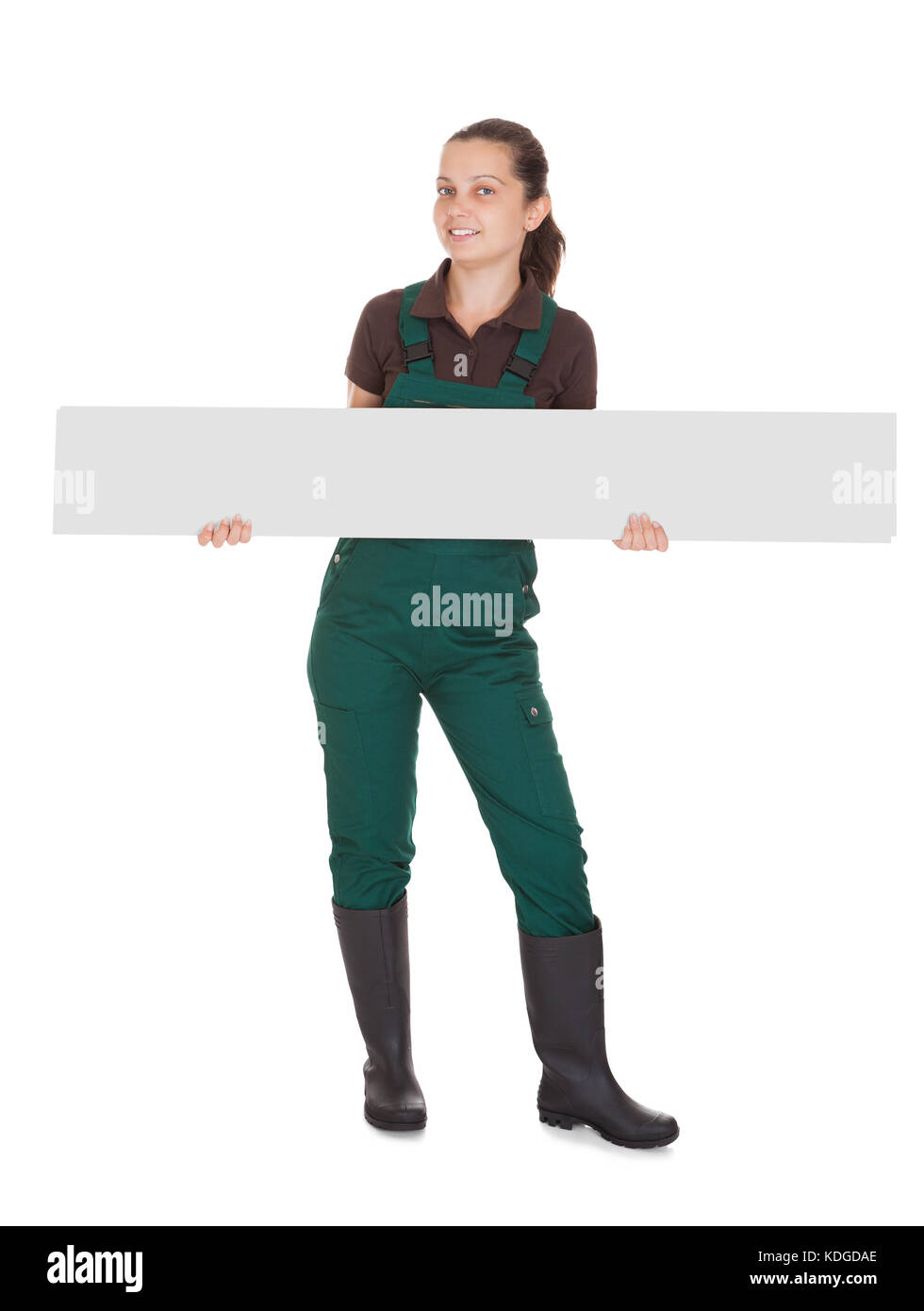Happy young Woman Holding Blank Placard On White Background Stock Photo