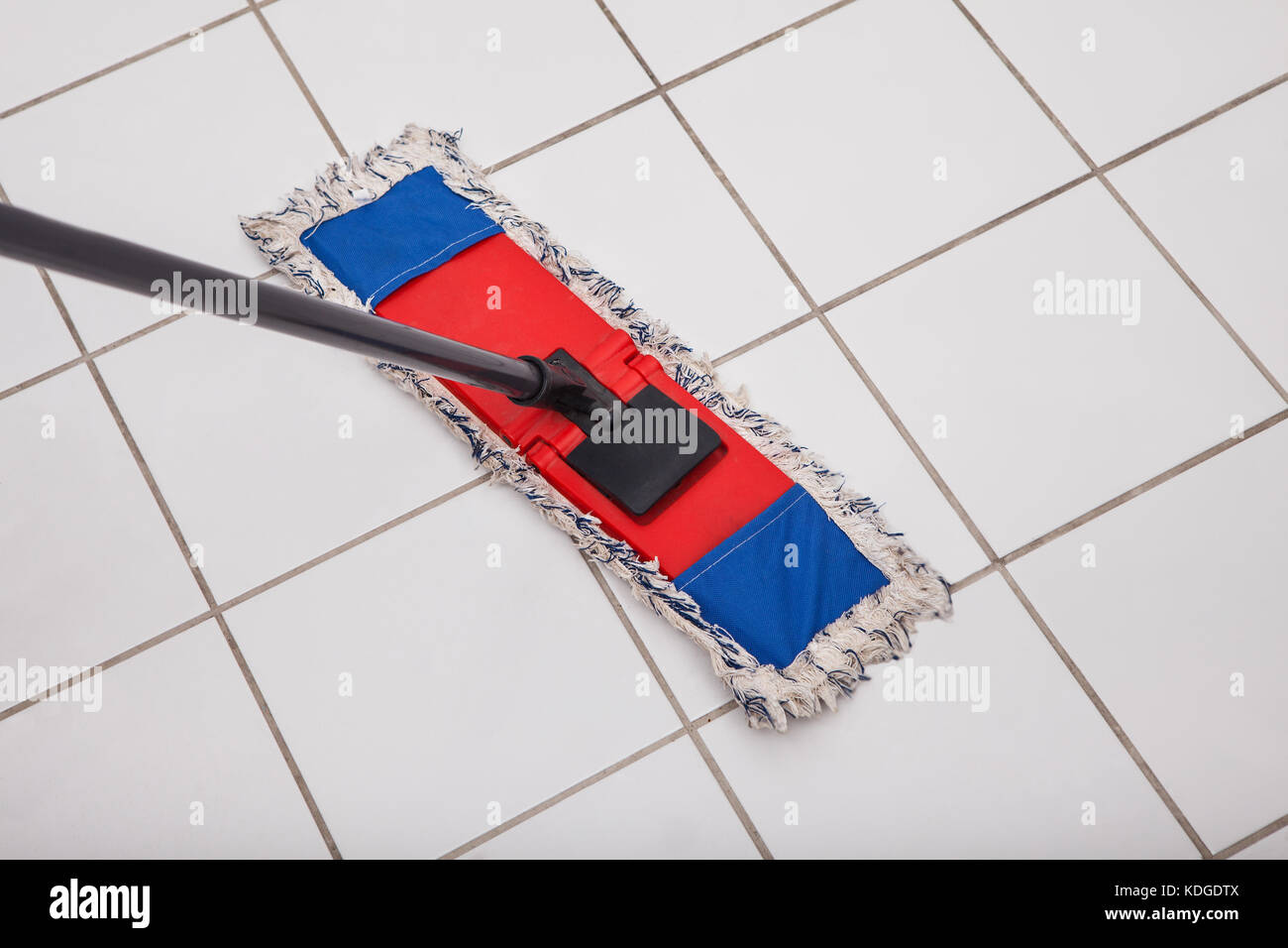 Close Up Of The Mop Washing The Tile Floor Stock Photo 163245962
