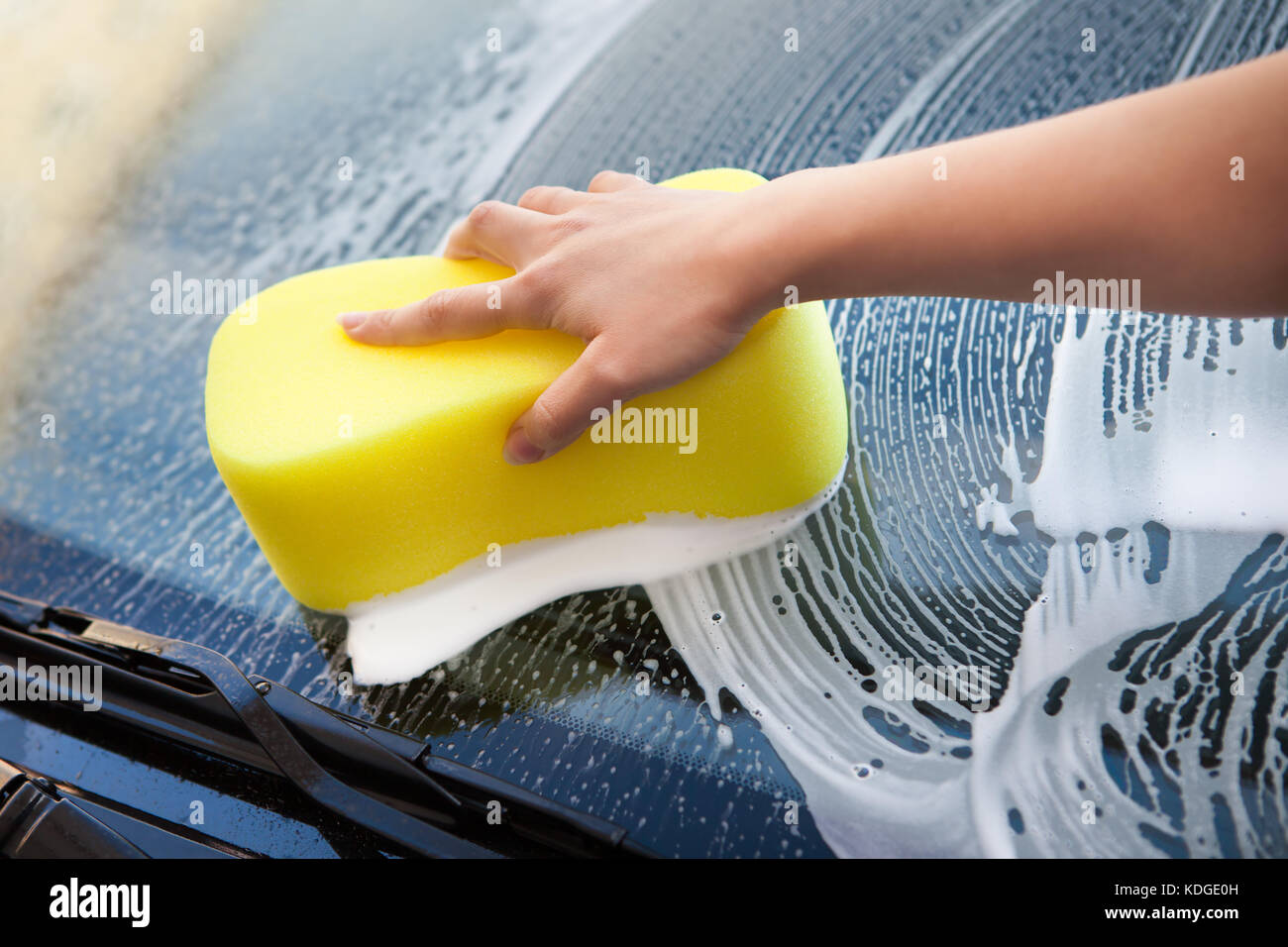 Closeup Of Hand Washing Windscreen With Yellow Sponge Stock Photo Alamy