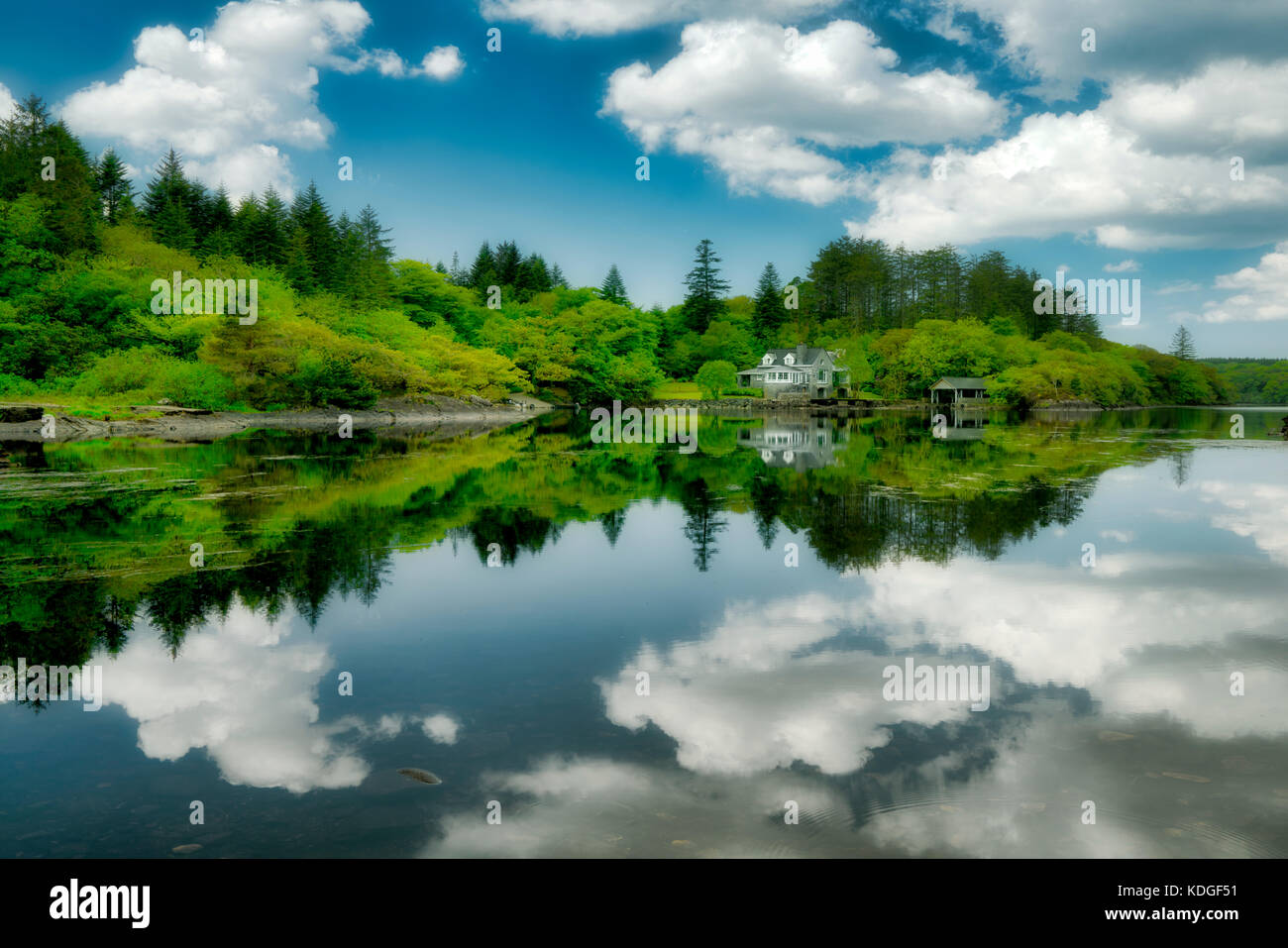 Still waters of Ballynahinch River with house. Connemara. County Galway, Ireland Stock Photo