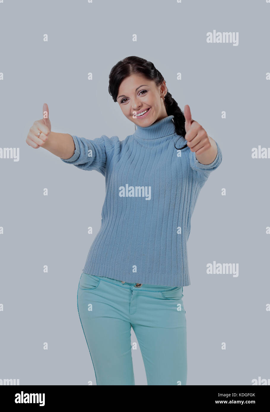 Thumb up. Smiling woman isolated white background Stock Photo