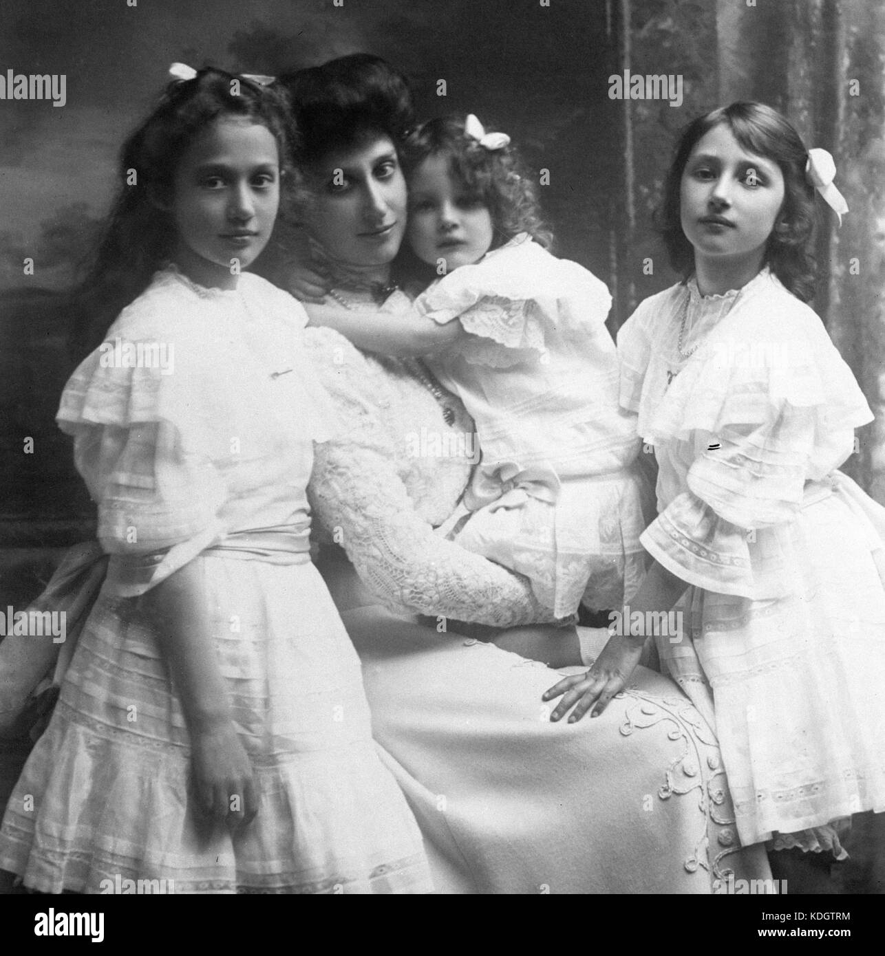 Princess Margaretha of Sweden (l) with sisters Astrid (r) and Martha, who is sat on her mother's knee, Princess Ingeborg of Denmark. Stock Photo