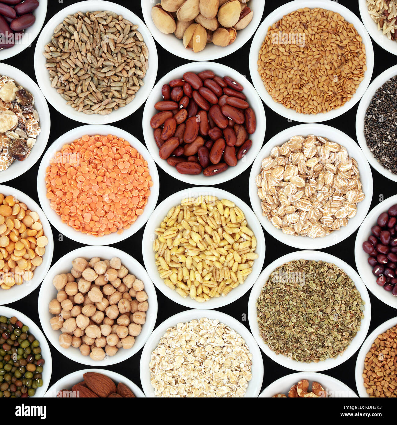 Dried high fiber health food with legumes, cereals, nuts, grain, seeds, with foods high in omega 3 fatty acid, antioxidants and vitamins, top view. Stock Photo