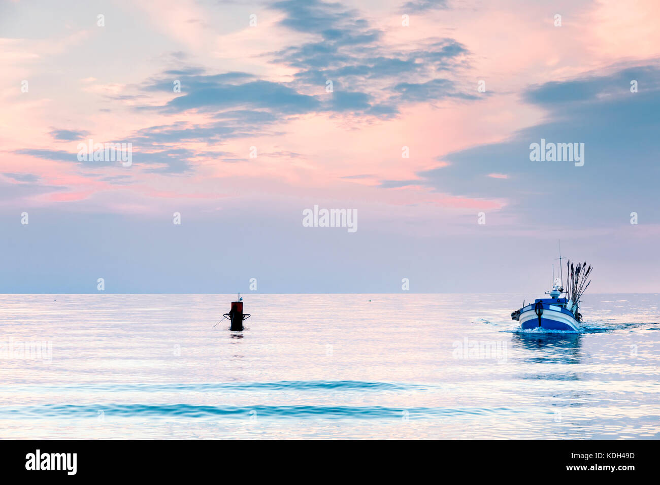 Sights of Poland. Sunset at Baltic sea with fishing boats. Stock Photo