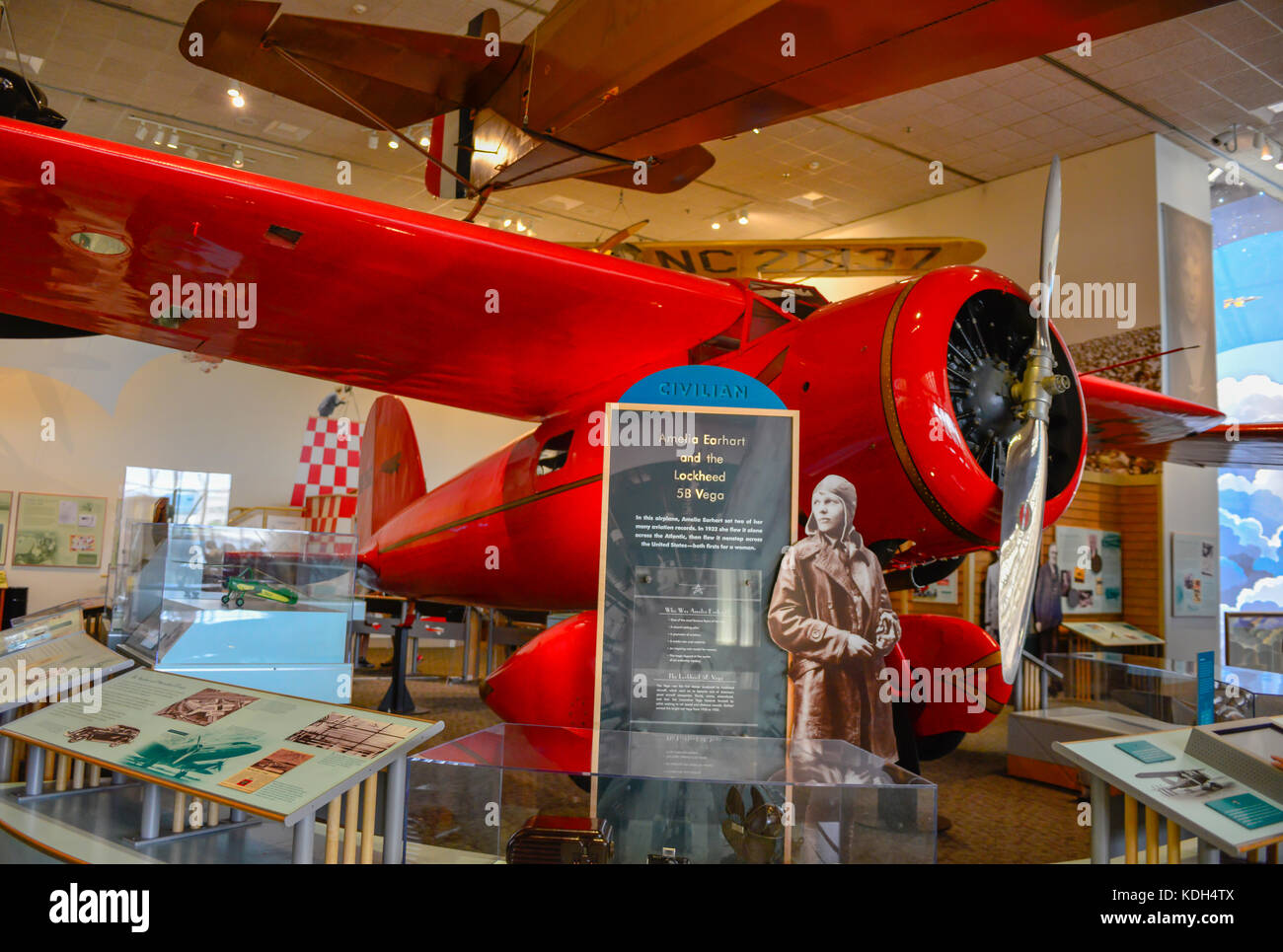 An exhibit of Amelia Earhart's plane, the Lockheed 5B Vega, with historical photo displays at the National Air and Space Museum in Washington, DC, USA Stock Photo