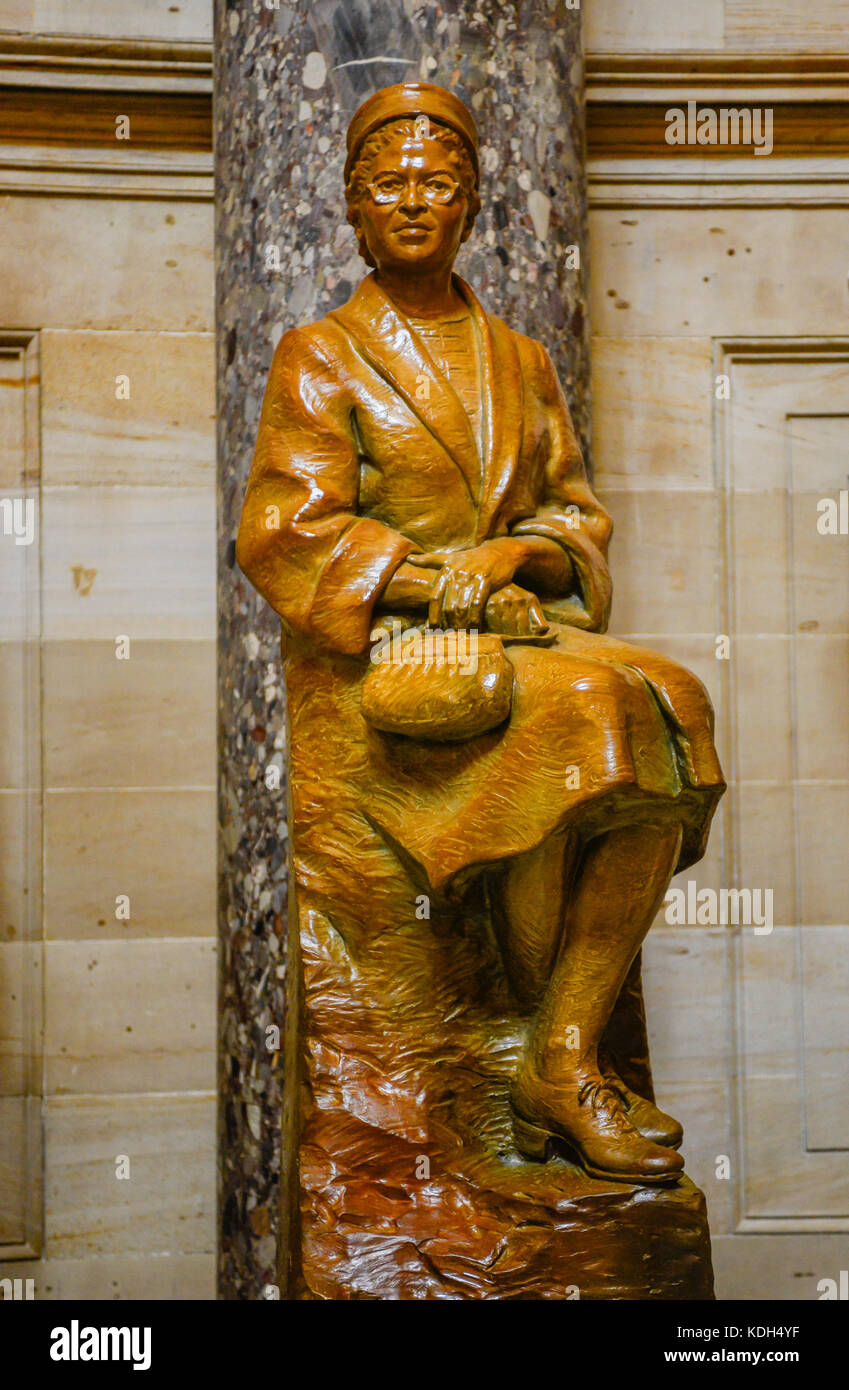 A statue of civil rights activist, Rosa Parks, sitting on a bus in bronze at National Statuary Hall in the US Capitol building in Washington, DC, USA Stock Photo