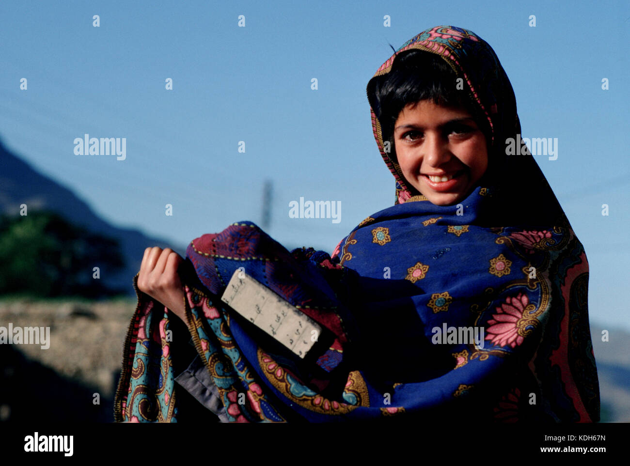 A young girl returning from school in the Swat Valley, Pakistan, 1990. Stock Photo