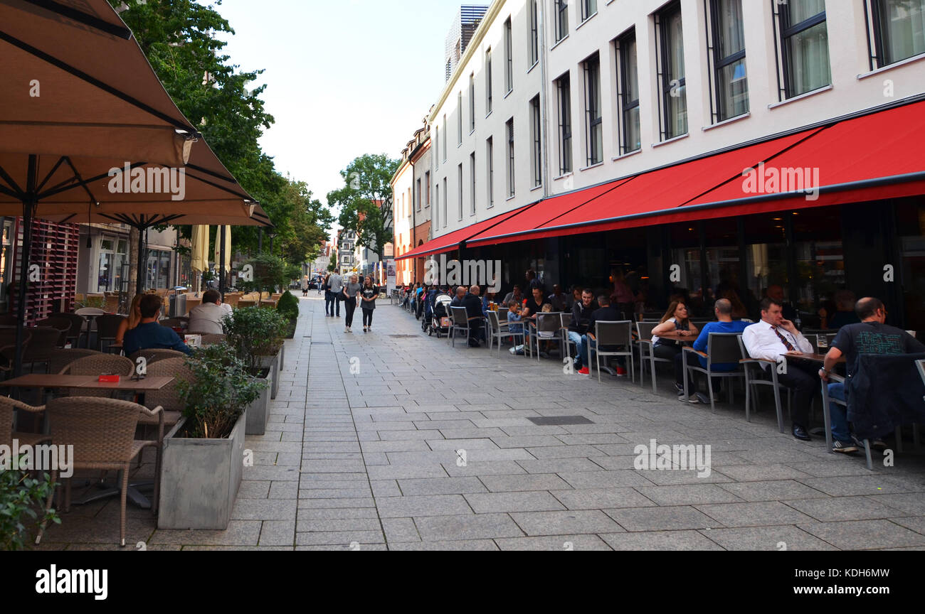 Ulm, Germany 28th July 2017 People eating dinner in a restaurant behind Ulm Minster Stock