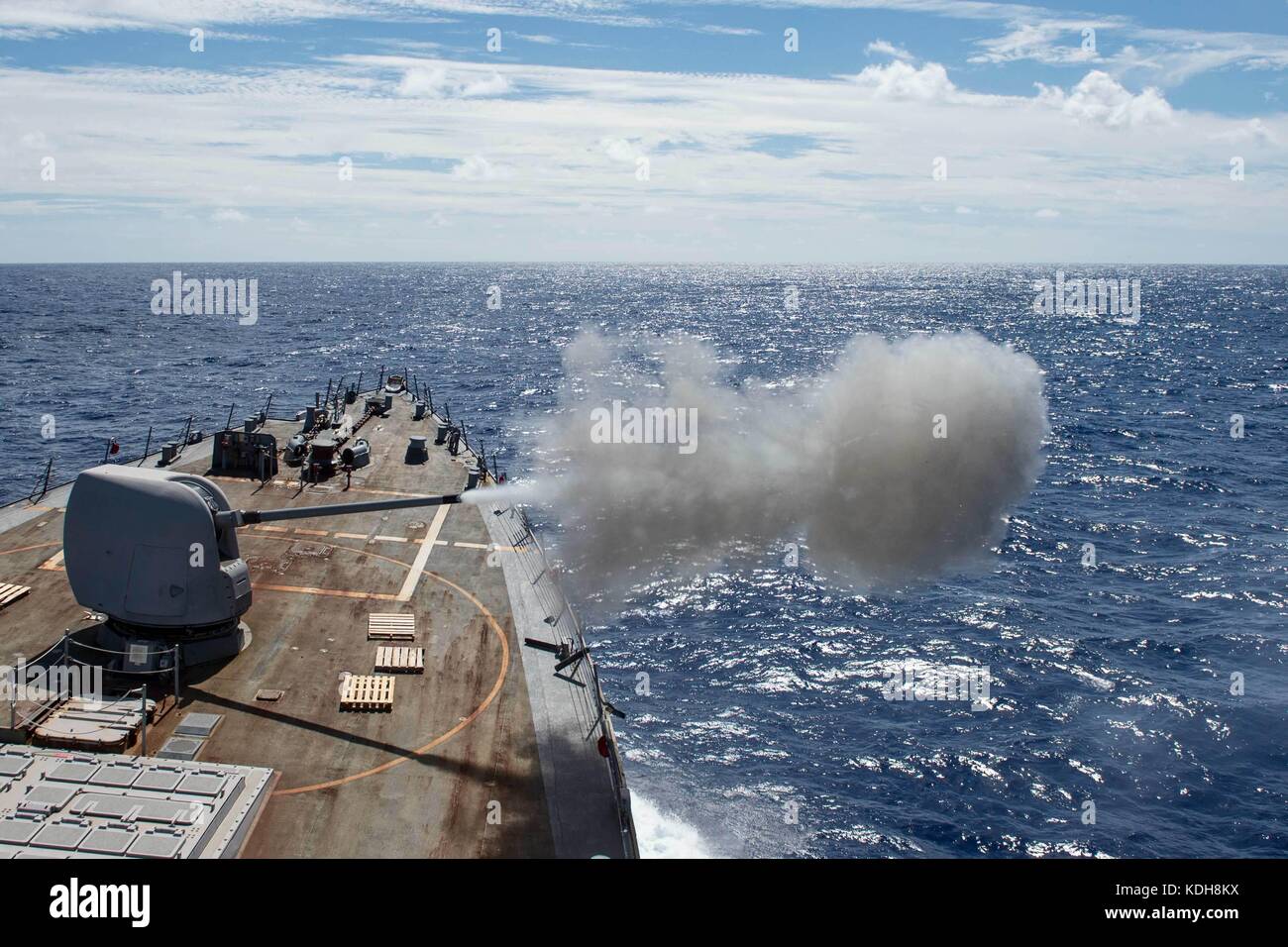 Warship fires its cannon Stock Photo