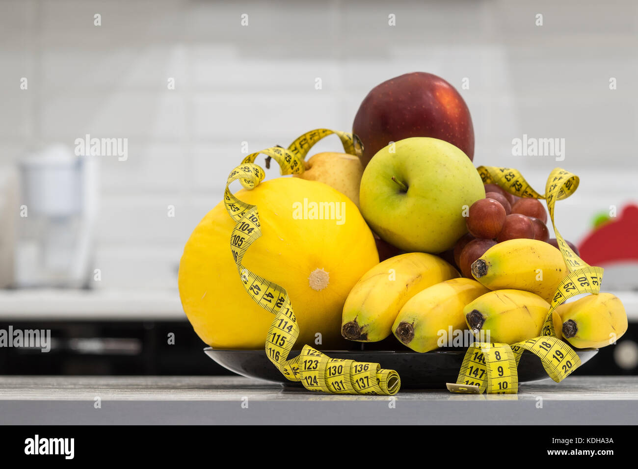Concept Of Diet Low Calorie Fruit Diet Diet For Weight Loss Plate With Measuring Tape And Fruits On The Table Vegetarian Diet For Weight Loss Wel Stock Photo Alamy