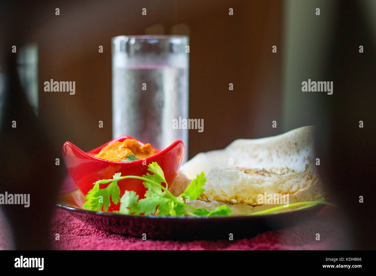 Indian Gee rice with complete curry meal served on a tray in a restaurant Stock Photo