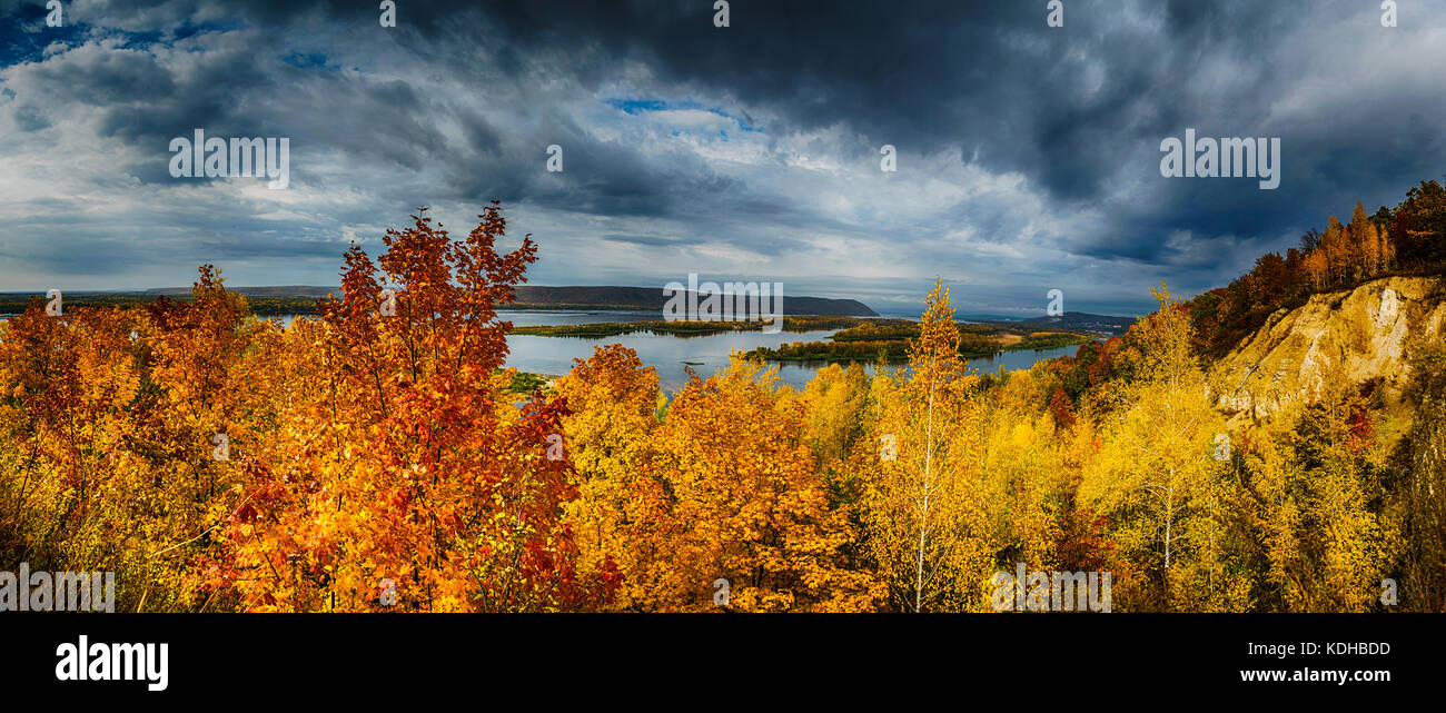 Panoramic view, yellow autumn trees on hill in front of Volga river Stock Photo