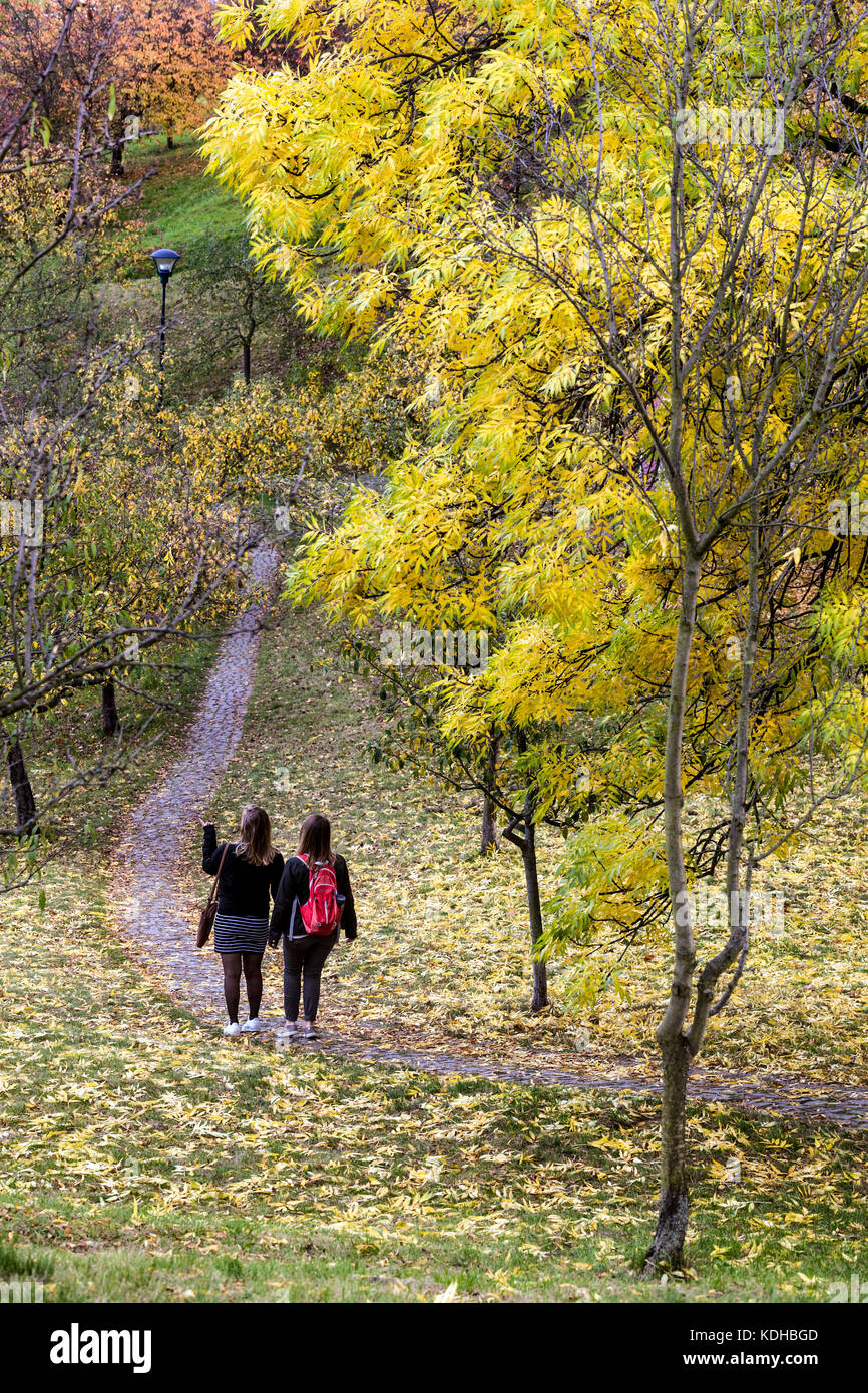 Two girls go down, Prague Petrin Hill Park Prague autumn Mala Strana, Czech Republic Stock Photo