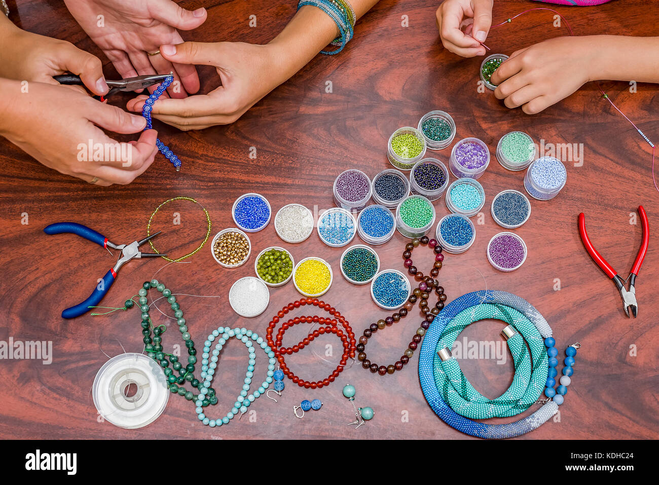 Making of handmade jewellery. needlework beads retro Stock Photo Alamy