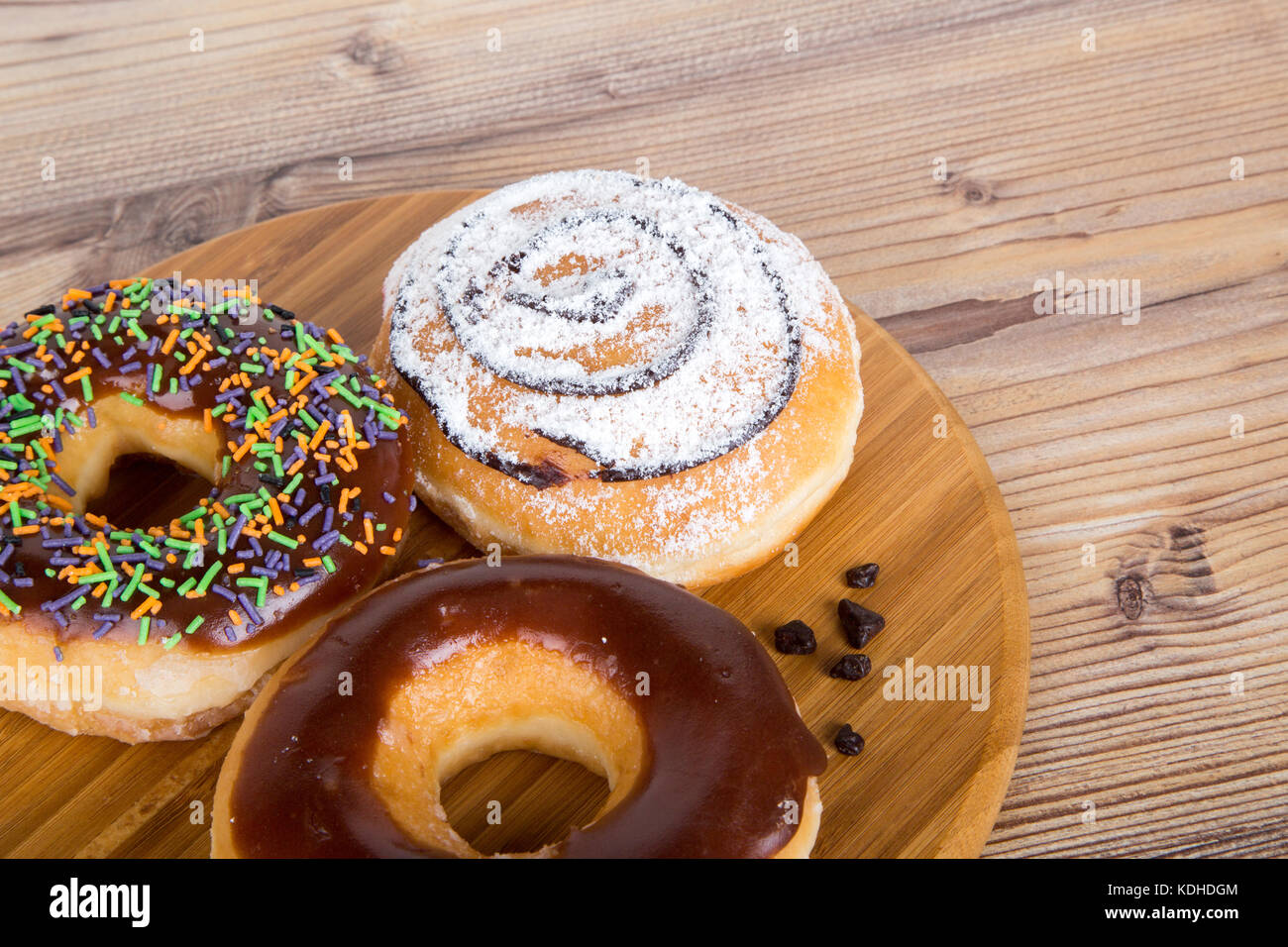 Close up detailed view of yummy donuts with chocolate, powdered sugar ...