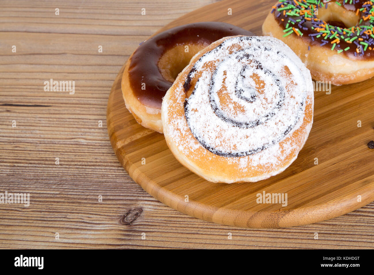 Close up detailed view of yummy donuts with chocolate, powdered sugar ...