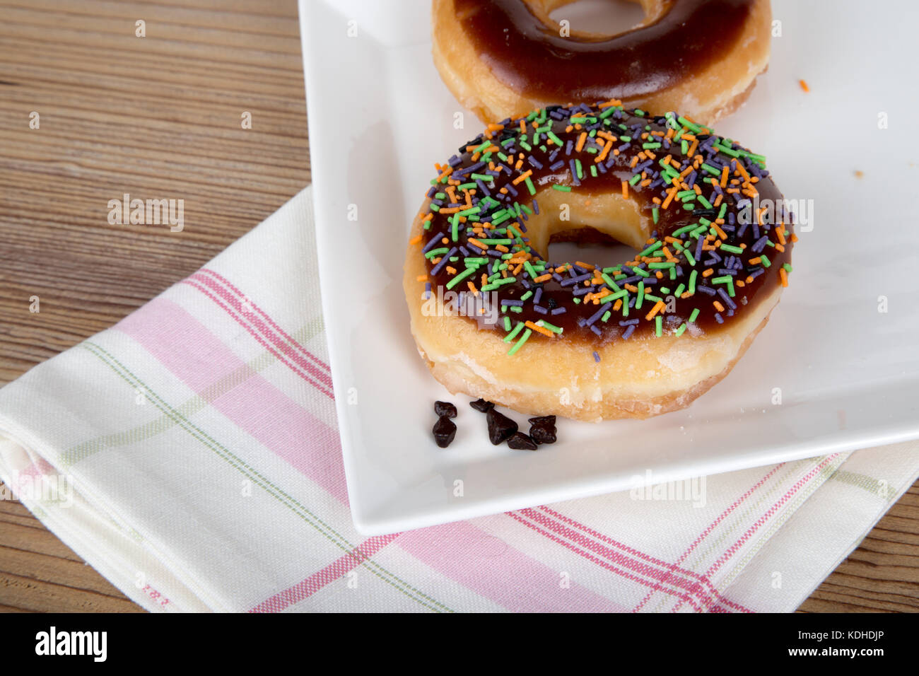 Close up detailed view of yummy donuts with chocolate, powdered sugar ...