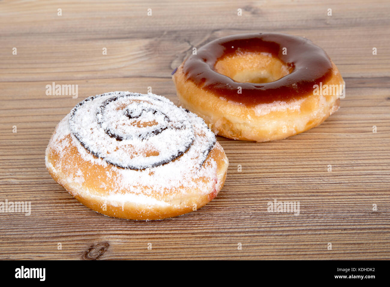 Close up detailed view of yummy donuts with chocolate, powdered sugar ...