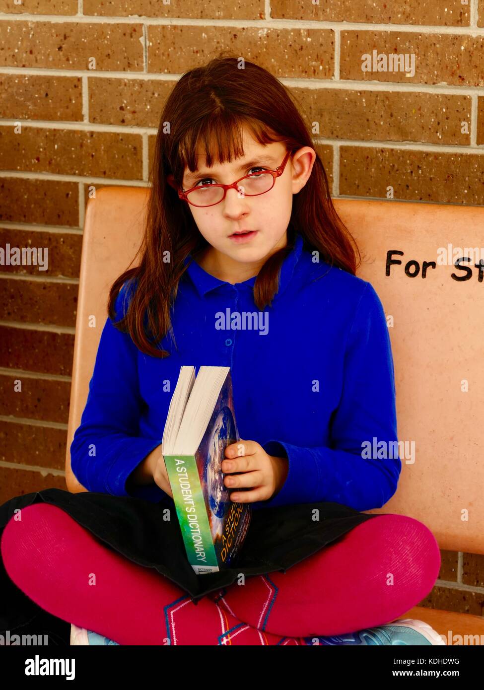 Child looking over dictionary hires stock photography and images Alamy