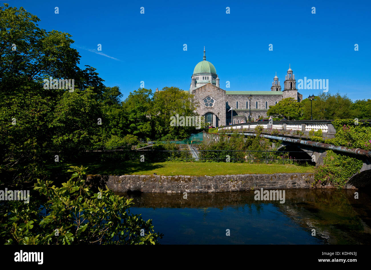 Galway Cathedral and Salmon Weir Bridge on Corrib river, Galway, County ...