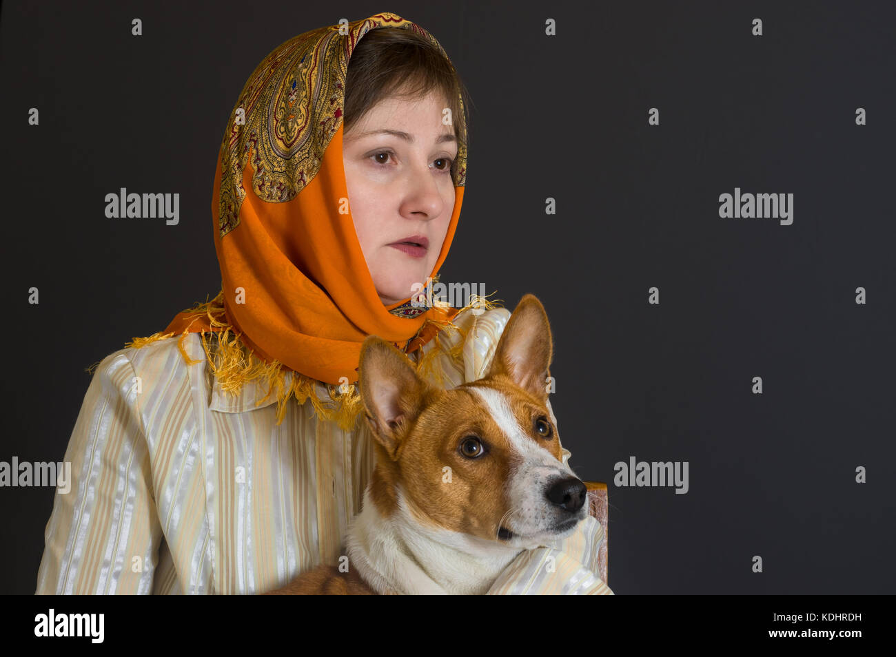 Nice portrait of beautiful Caucasian mature woman with lovely basenji dog Stock Photo