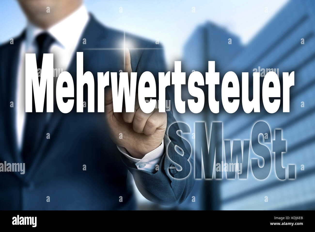 Mehrwertsteuer (in German VAT) touchscreen is operated by business man. Stock Photo