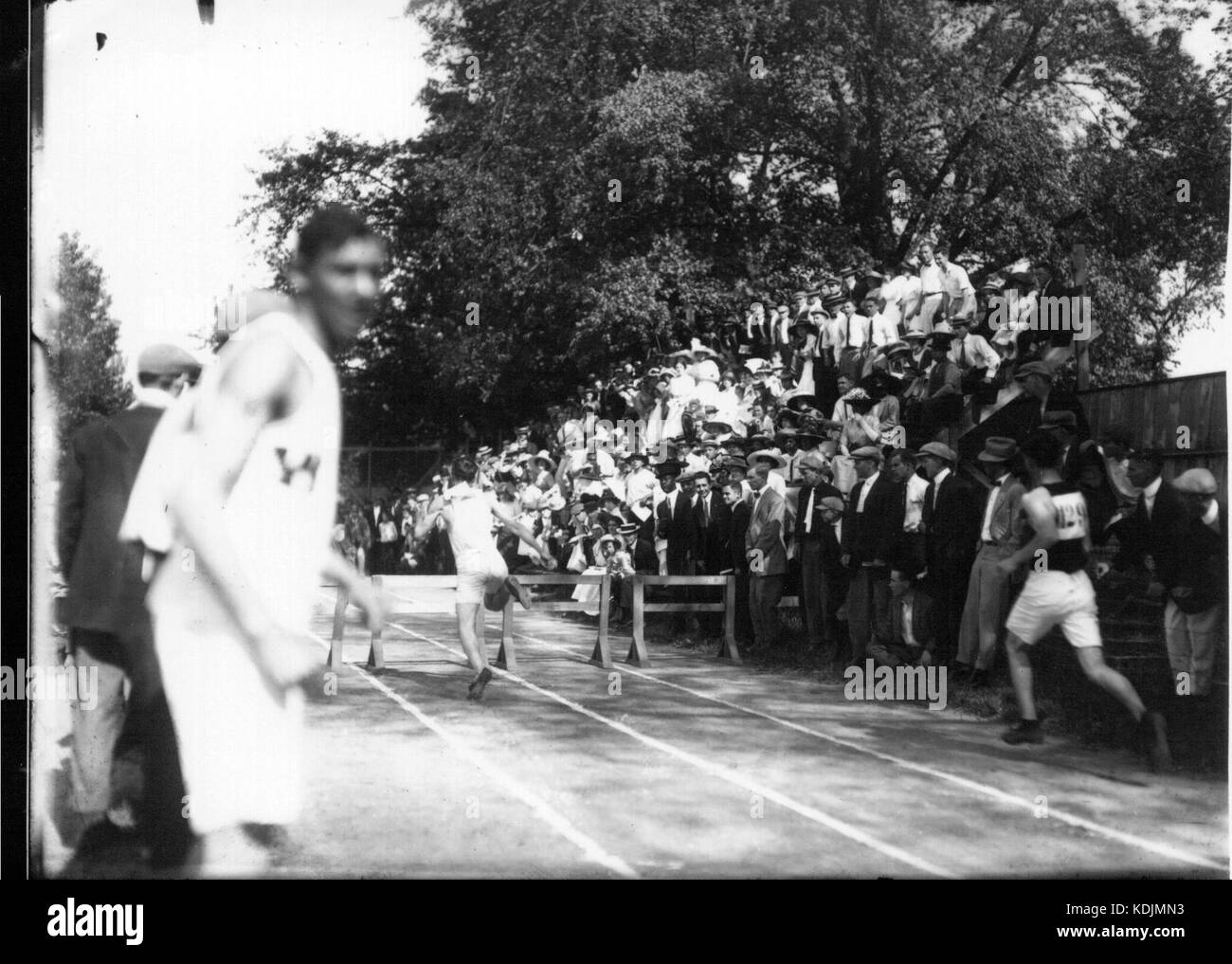 Hurdle racing event at high school track meet 1912 (3191714604 Stock