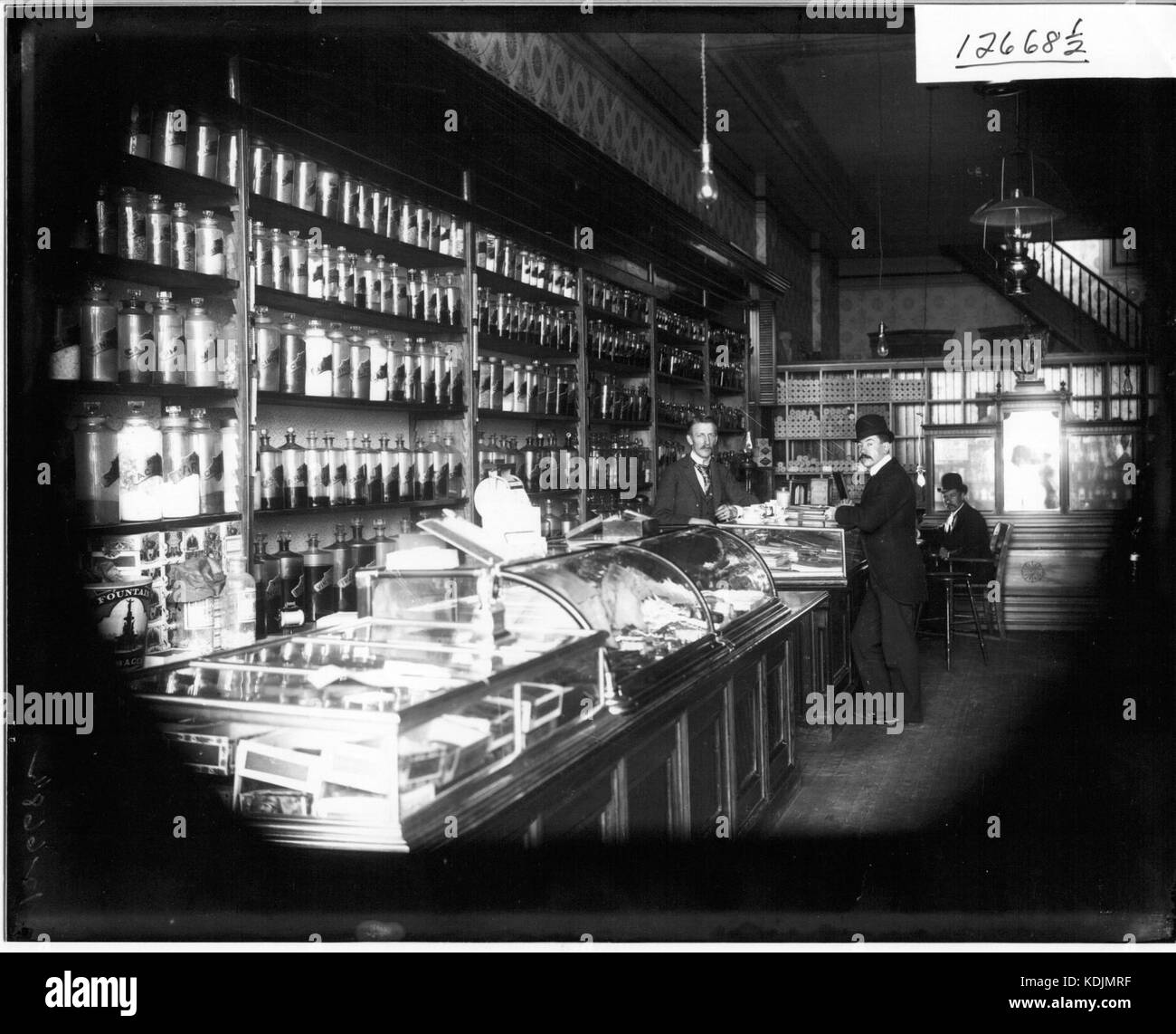 Men inside Oxford Drug Store 1913 (3190827837) Stock Photo