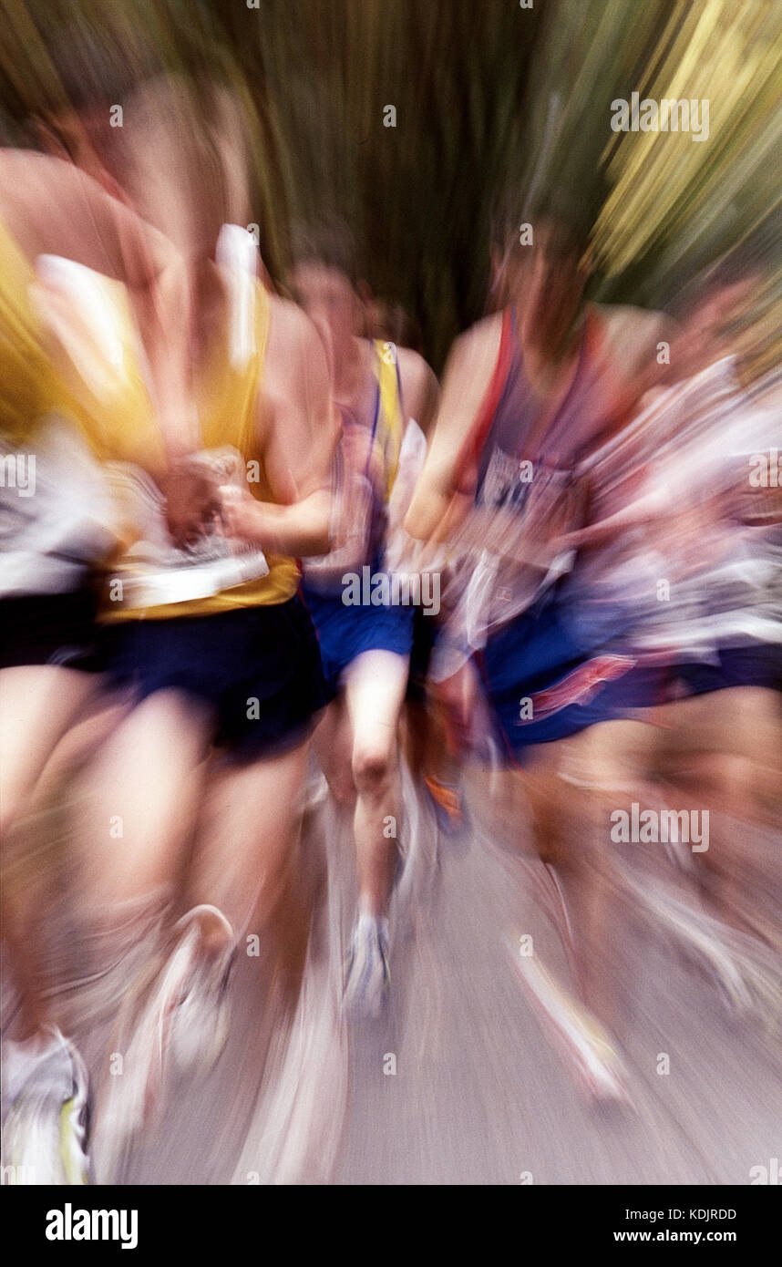 Blurred action of High School boys cross country running race. Stock Photo