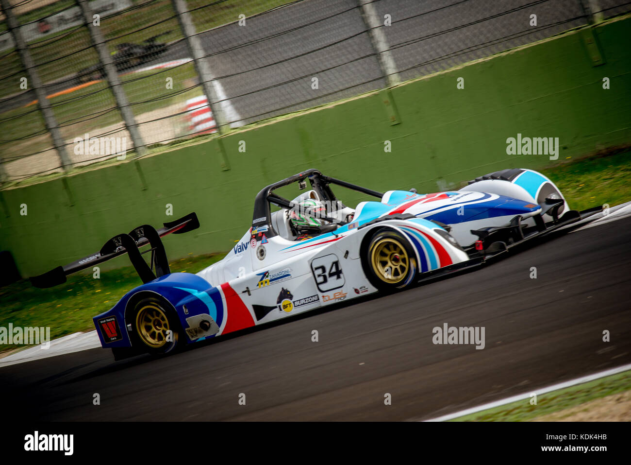Prototype car in action at turn during the race blurred background Stock Photo