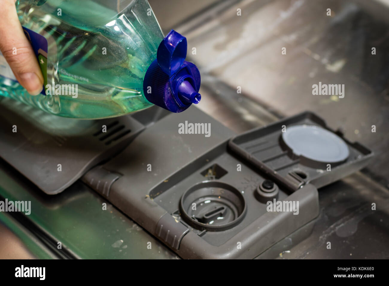 Dishwasher with dirty dishes. Powder, dishwashing tablet and rinse aid