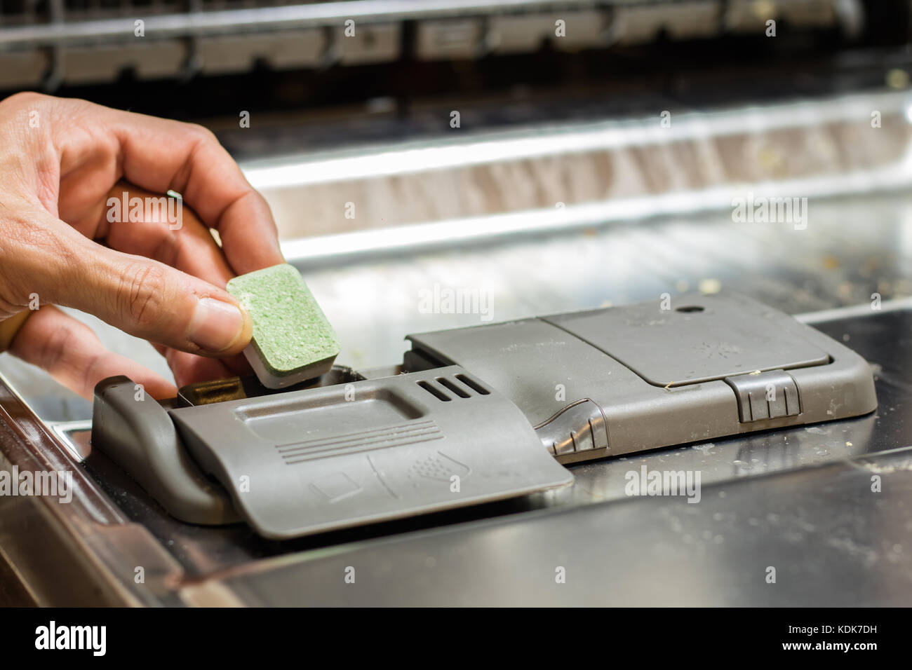 Dishwasher with dirty dishes. Powder, dishwashing tablet and rinse aid