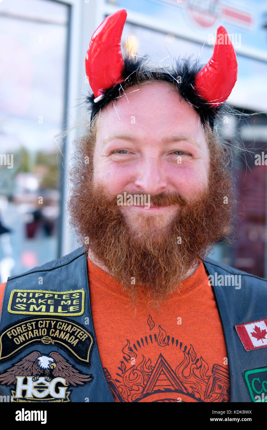 a hairy aggressive looking hells angels type of biker on a