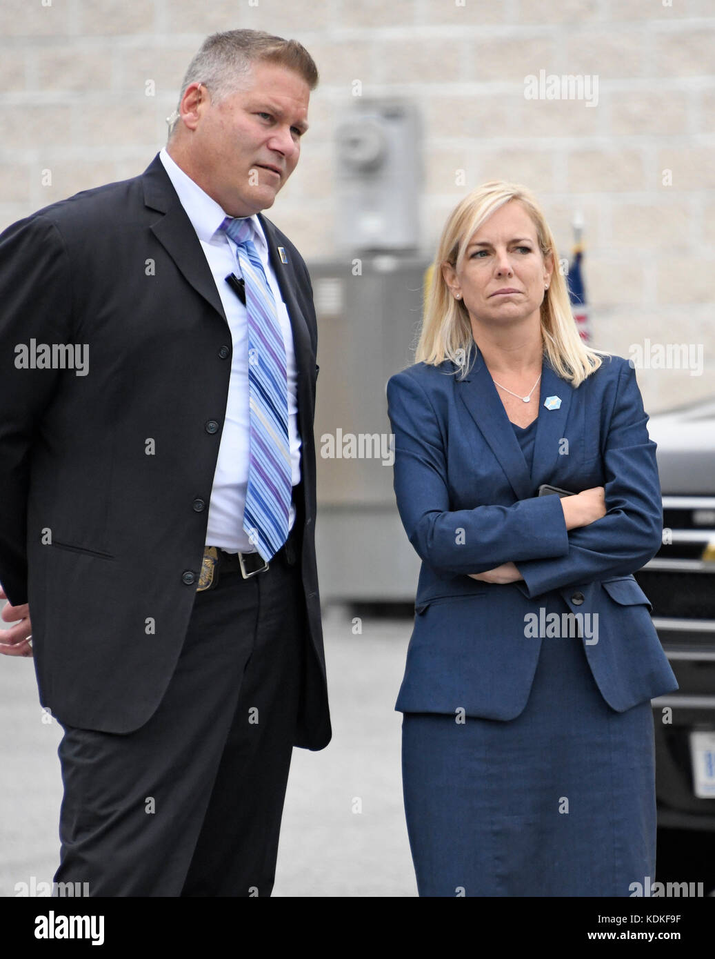 United States Secretary of Homeland Security-designate Kirstjen Nielsen, right, and an unidentified Secret Service agent look on as US President Donald J. Trump tours the US Secret Service James J. Rowley Training Center in Beltsville, Maryland on Friday, October 13, 2017. Credit: Ron Sachs/Pool via CNP - NO WIRE SERVICE · Photo: Ron Sachs/Consolidated News Photos/Ron Sachs - Pool via CNP Stock Photo