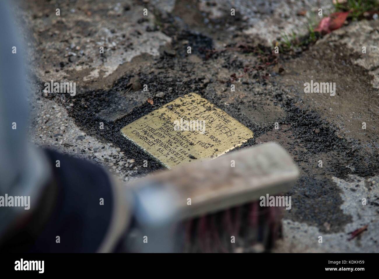 Munich, Bavaria, Germany. 14th Oct, 2017. Despite lengthy battles, the so-called Stolpersteine ('Stumbling Blocks'') containing the names & information of victims of National Socialism were installed at four different sites in Munich. The City of Munich forbid the installation of the memorial stones on public ground in 2015, which led the Stolpersteine Initiative (''˜Stumbling Block Initiative'') to seek private properties to install them. To date, 61,000 Stolpersteine in 2,000 cities in 21 countries have been dedicated, with much criticism lobbed against Munich's rejection due to Stock Photo
