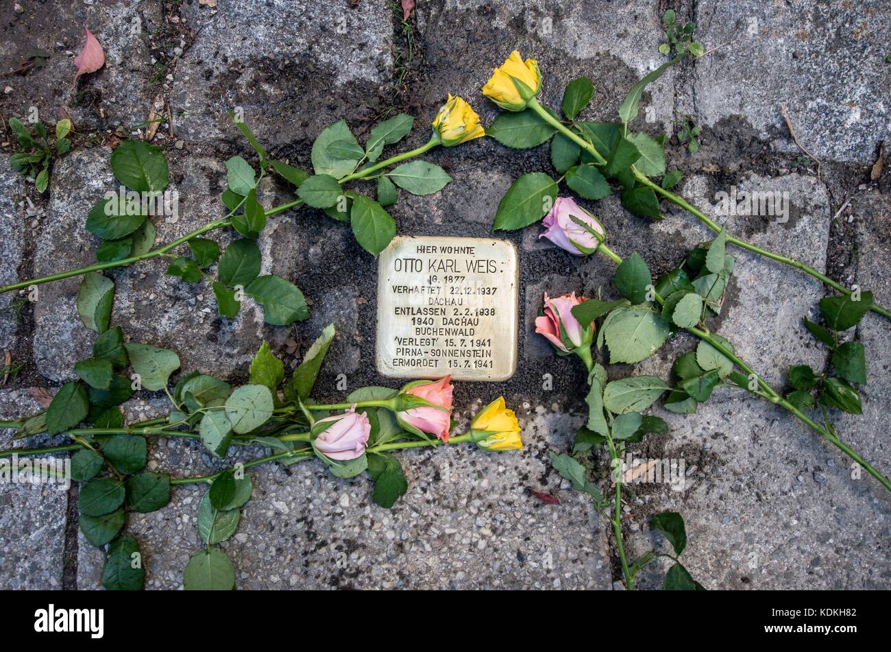 Munich, Bavaria, Germany. 14th Oct, 2017. Despite lengthy battles, the so-called Stolpersteine ('Stumbling Blocks'') containing the names & information of victims of National Socialism were installed at four different sites in Munich. The City of Munich forbid the installation of the memorial stones on public ground in 2015, which led the Stolpersteine Initiative (''˜Stumbling Block Initiative'') to seek private properties to install them. To date, 61,000 Stolpersteine in 2,000 cities in 21 countries have been dedicated, with much criticism lobbed against Munich's rejection due to Stock Photo
