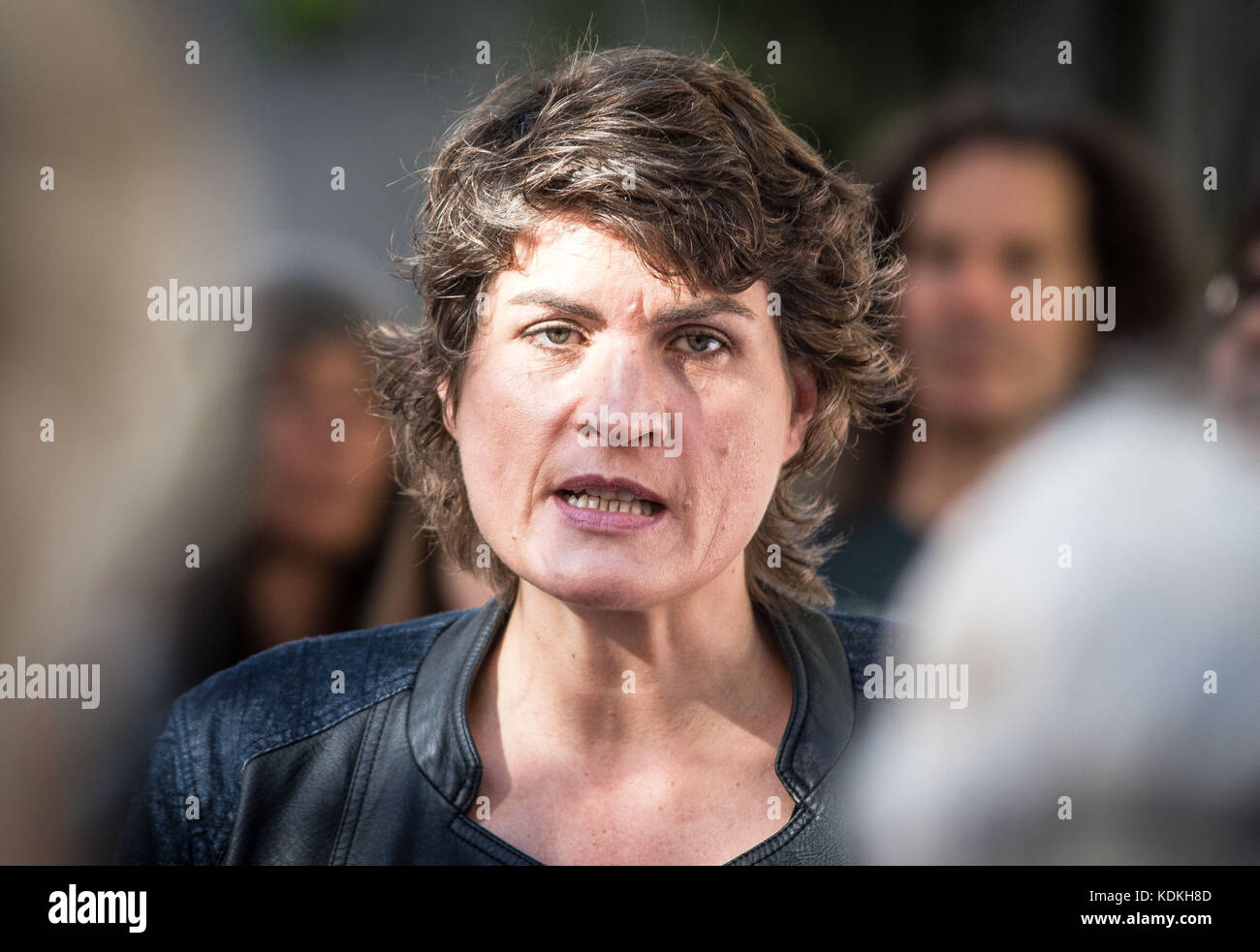 Munich, Bavaria, Germany. 14th Oct, 2017. Claudia Stamm of the Bavarian Parliament. Despite lengthy battles, the so-called Stolpersteine ('Stumbling Blocks'') containing the names & information of victims of National Socialism were installed at four different sites in Munich. The City of Munich forbid the installation of the memorial stones on public ground in 2015, which led the Stolpersteine Initiative (''˜Stumbling Block Initiative'') to seek private properties to install them. To date, 61,000 Stolpersteine in 2,000 cities in 21 countries have been dedicated, with much criticism l Stock Photo