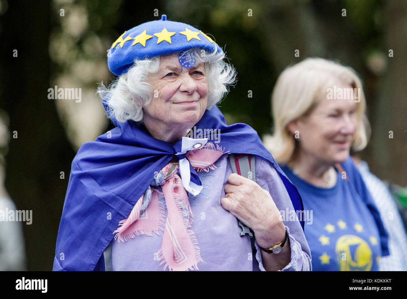 Bristol, UK, 14th October, 2017. Pro EU supporters are pictured wearing a blue bath for eu beret as they listen to speeches during a anti Brexit protest rally in College Green. The rally was held to allow people to show their support for the UK remaining part of the European Union and to celebrate the South-West and Gibraltar  European Parliament Constituency and the benefits that the region enjoys as part of the European Union. Stock Photo