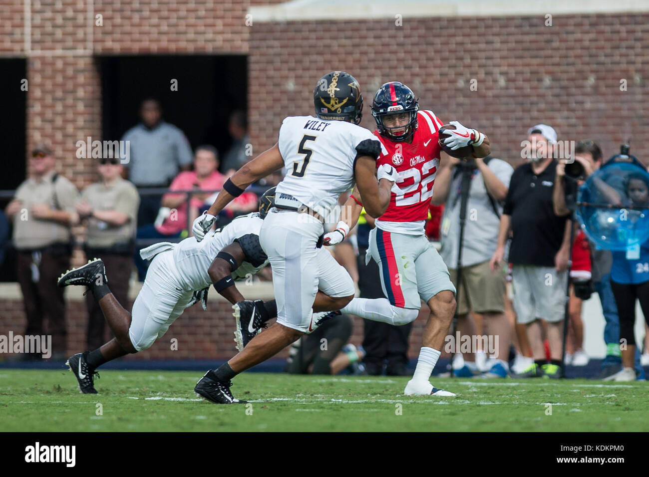Oxford, USA.  14th October 2017. The University of Mississippi’s Jordan Wilkins (22) tries to avoid being tackled by Vanderbilt’s LaDarius Wiley (5) early in the contest at Vaught-Hemingway Stadium in Oxford, Mississippi, on Saturday, October 14, 2107.  Credit: Kevin Williams/Alamy Live News. Stock Photo