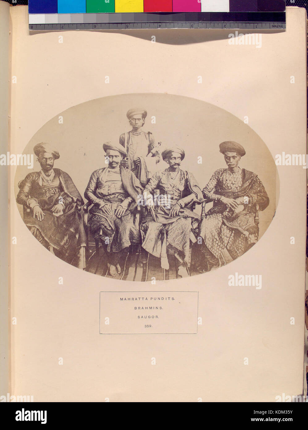 This photograph depicts Mahratta Pundits and Brahmins in Saugor, India. The image provides a glimpse into the cultural and social roles of these groups within Indian society during the period, highlighting their dress, customs, and social position. Stock Photo