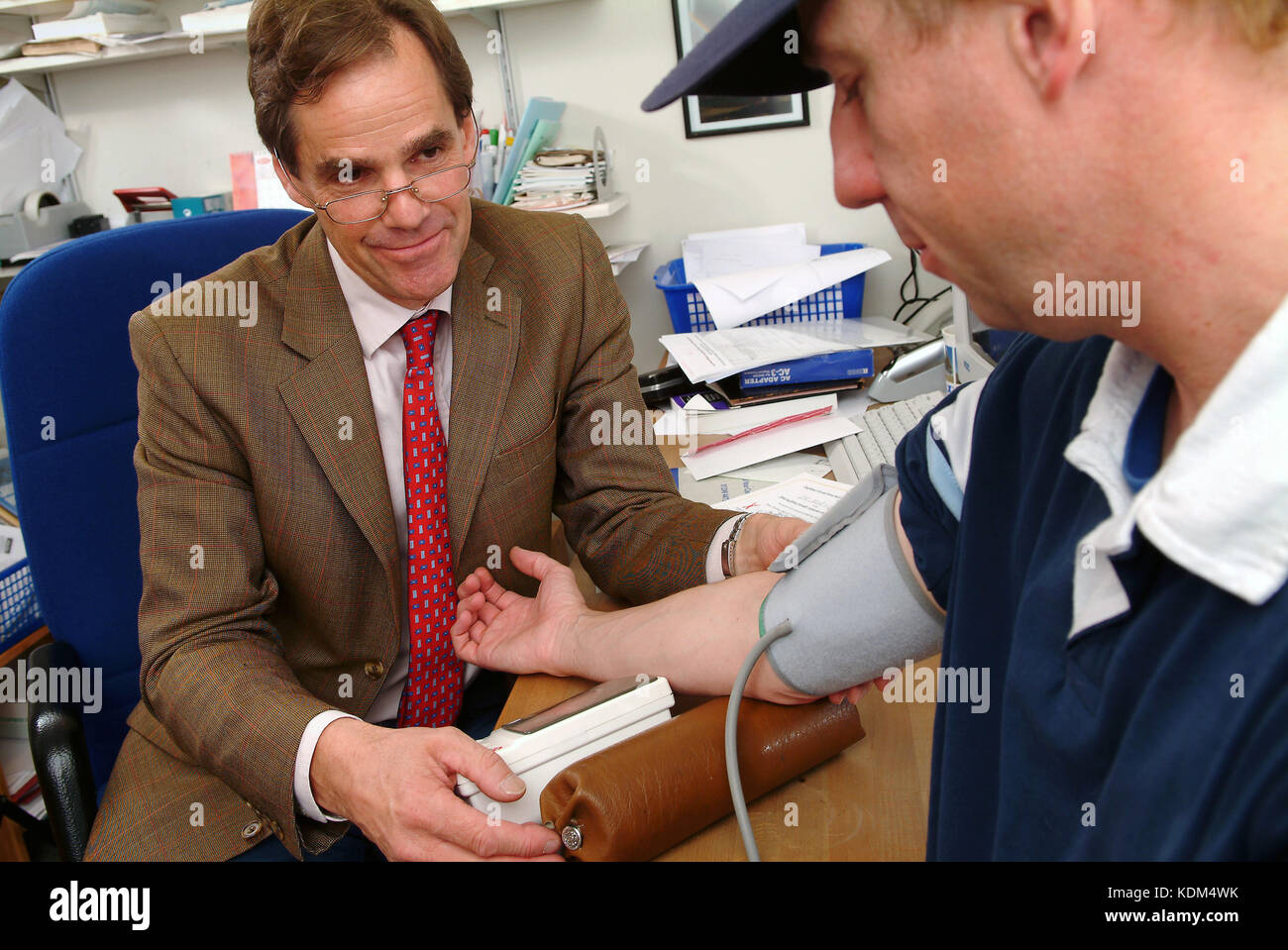 Dr.Robert Muir (The Lodge Surgery, Chippenham) taking a patient's blood