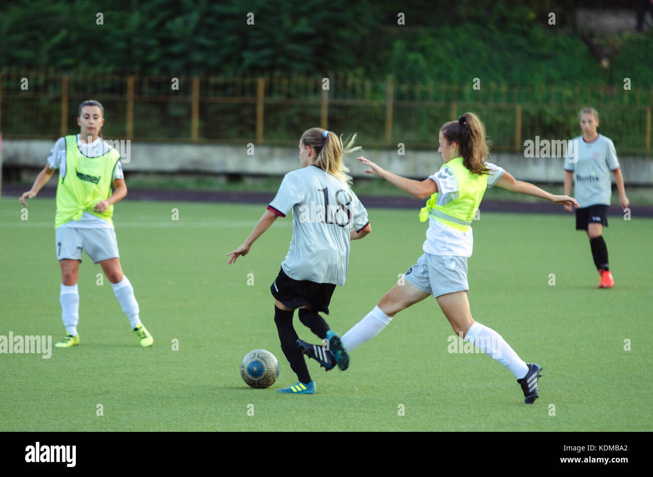Woman makes a foul in football Stock Photo