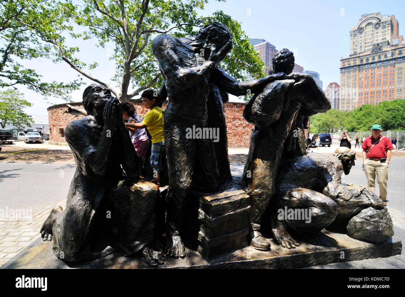 The Immigrants sculpture at Battery park in Lower Manhattan Stock Photo