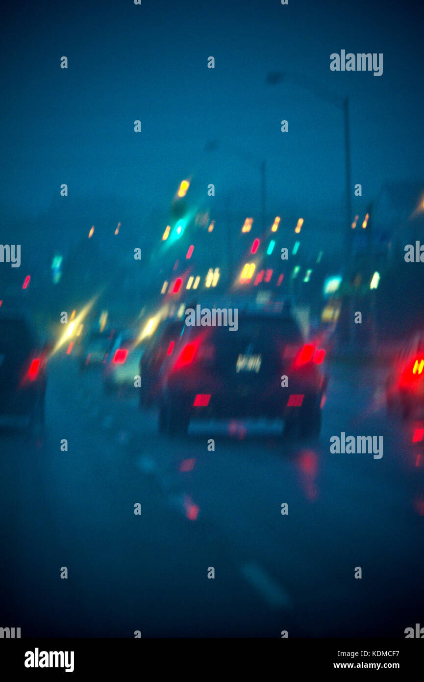 Blurred image of a car driving in the rain at night Stock Photo - Alamy