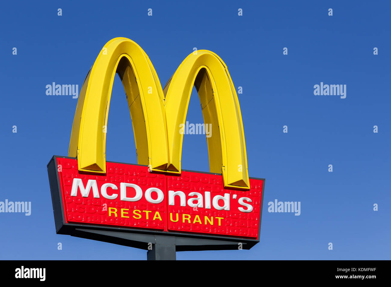 Horsens, Denmark - september 30, 2015: McDonald's logo on a pole. McDonald's is the world's largest chain of hamburger fast food restaurants Stock Photo