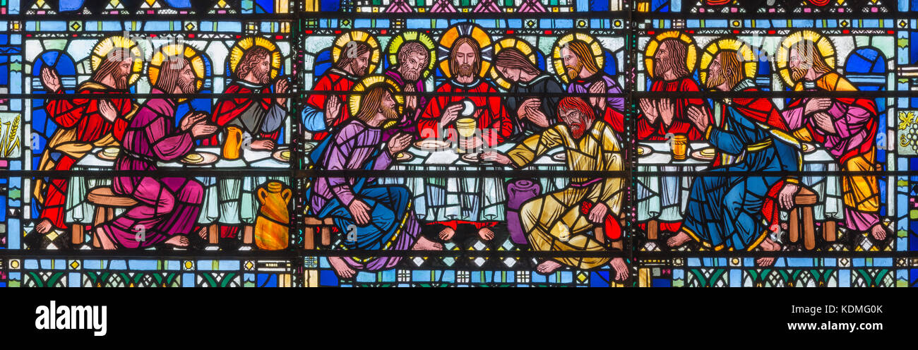 LONDON, GREAT BRITAIN - SEPTEMBER 16, 2017: The stained glass of Last Supper the Pantokrator in church St Etheldreda by Joseph Edward Nuttgens (1952). Stock Photo