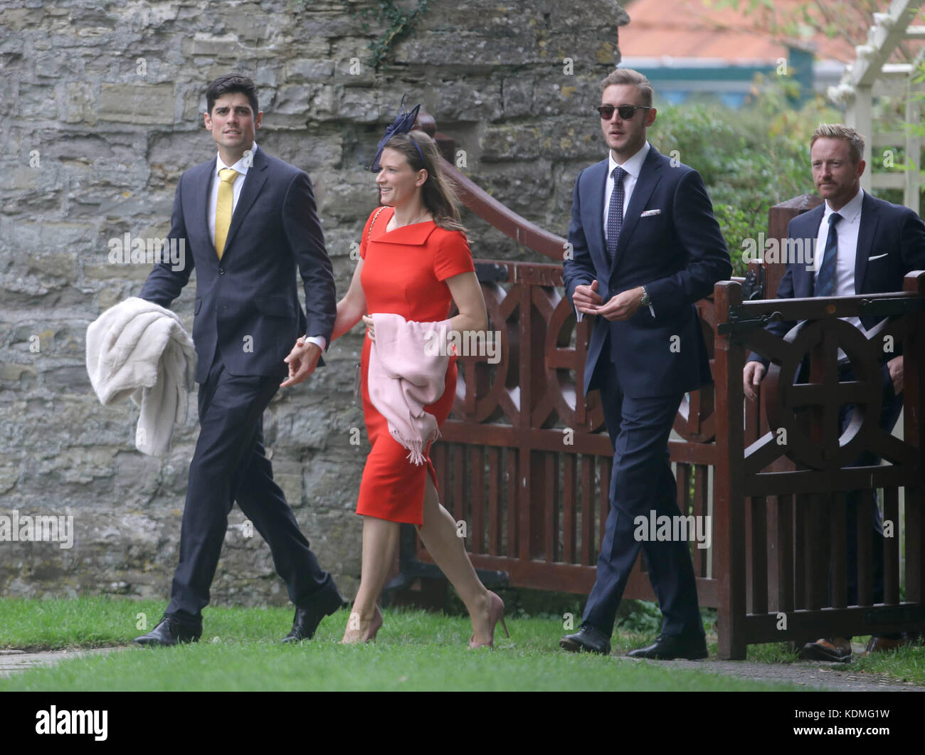 England cricket player Alastair Cook (left) with his wife Alice, and Stuart  Broad (second right) and Paul Collingwood arrive at St Mary the Virgin,  East Brent, Somerset, for the wedding of Ben