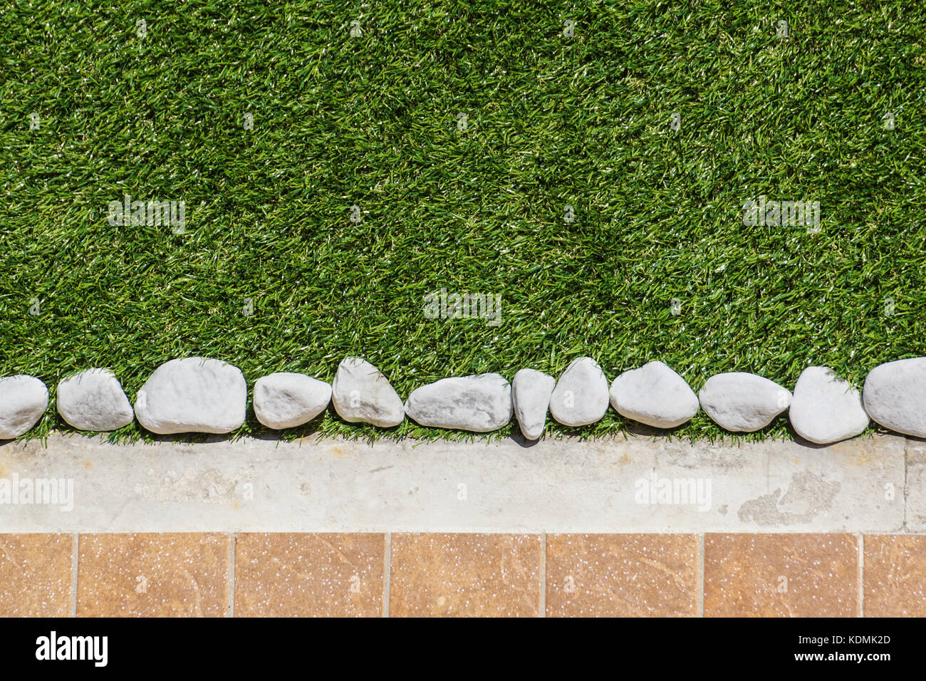 Floor design with tiles and ornamental gravel . Various materials for